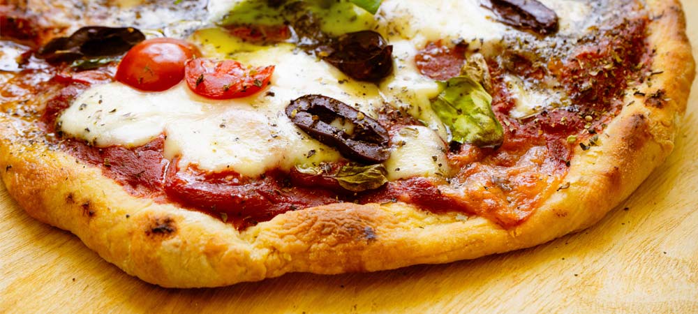 Pizza with Kalamata Olives, Plum Tomatoes and Basil